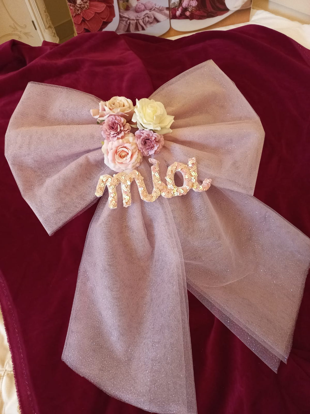 Fiocco nascita in tulle glitterato con nome personalizzato.